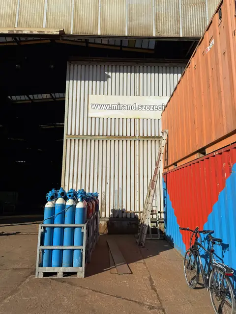 Workshop gate at ul. Antosiewicza 1 in Szczecin, where finished parts are collected