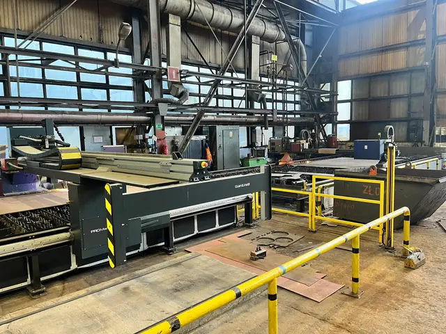 Gantry of the STIGAL PROMaster 3D and parts cut from plate